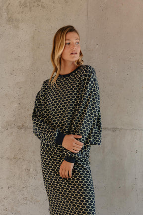 Violette fait du 34 et porte une taille XS en bas et un XS/S en haut